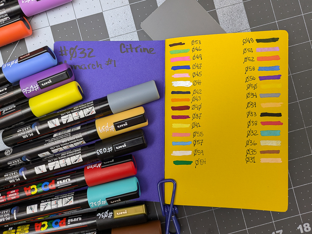 First page of a small colored journal with many different colored marker lines